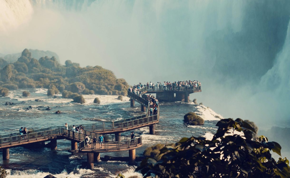 Tourists marvel at the breathtaking Iguazu Falls, a UNESCO World Heritage Site.